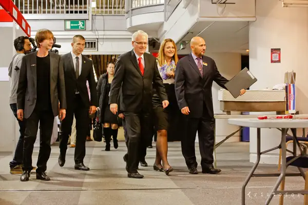 Visitors in suits touring the exhibition at the British Invention Show 2014