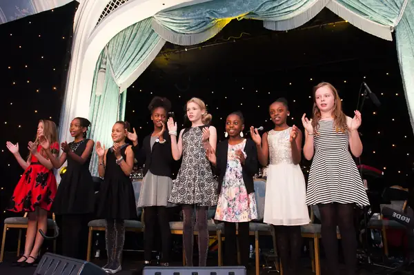 Girls performing on stage beneath the curtains at the 2014 bis Awards at The Savoy