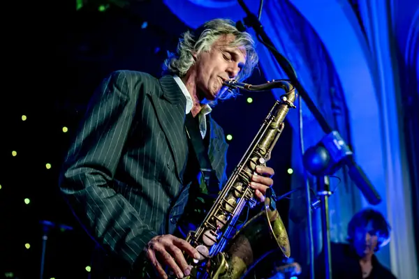 Saxophonist under blue stage light at the 2014 bis Awards at The Savoy