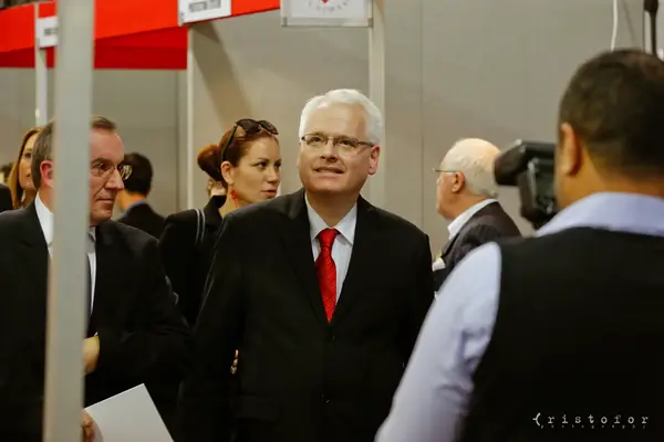 Visitors in suits on a tour of the exhibition at the British Invention Show 2014