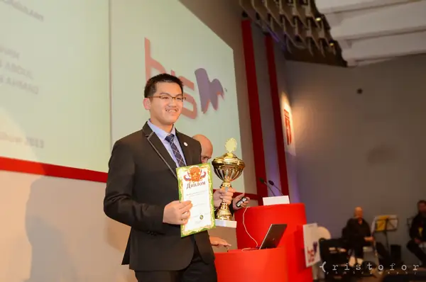 Winner with a gold cup and diploma on stage at the British Invention Awards 2013