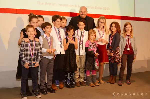 Young inventors wearing their medals on stage at the British Invention Awards 2013